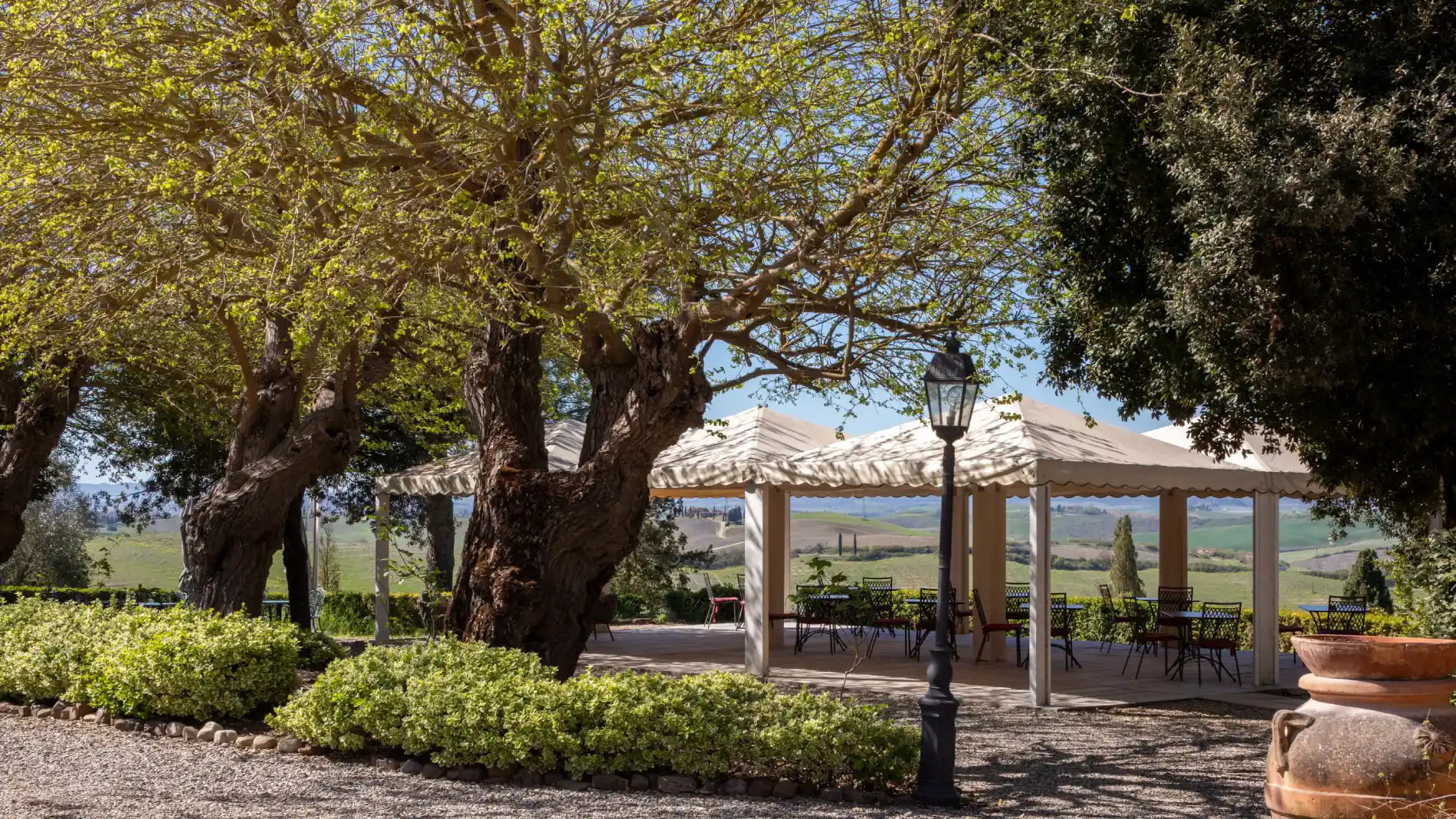 Outdoor terrace with gazebo seating surrounded by Crete Senesi countryside with panoramic views - Castello di Leonina, BZAR hotels in Tuscany