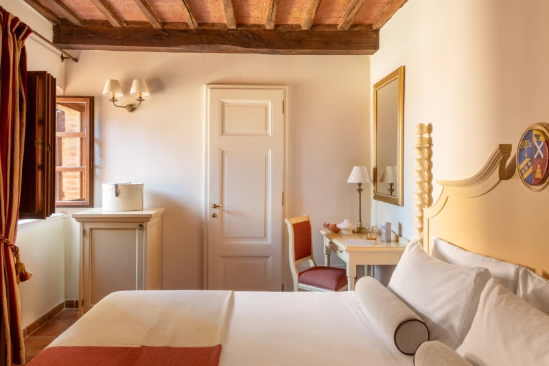 Bright Tuscan double room view of the charming Tuscan countryside, exposed beams, desk and refined details near Siena - Castello di Leonina, BZAR hotels in Tuscany