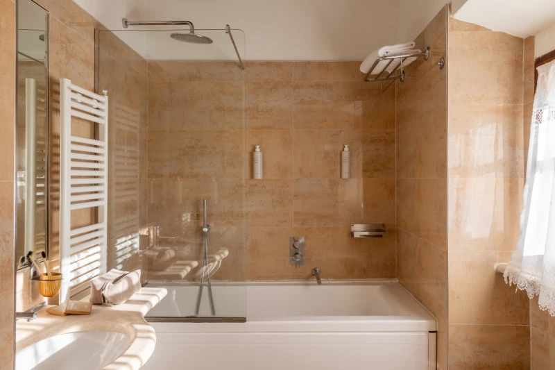 Junior suite detail with mirrored wardrobe, writing desk and classic decorations in a charming Tuscan relais - Castello di Leonina, BZAR hotels in Tuscany